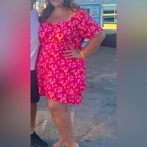 Plus size pink floral off the shoulder romper.